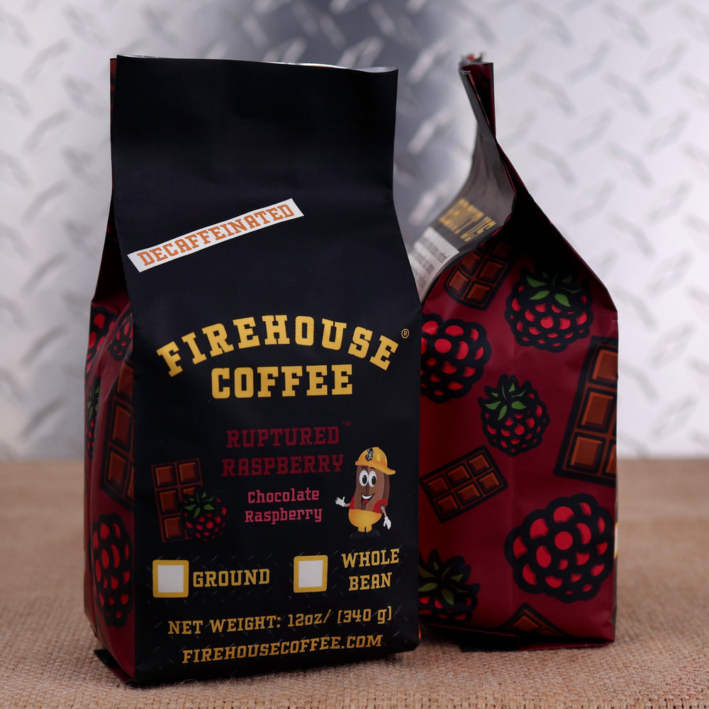 Firehouse Coffee Ruptured Raspberry Decaf Chocolate Raspberry Flavored Coffee in a 12 oz bag, crafted with premium Swiss Water Process decaffeinated coffee and infused with rich milk chocolate and sweet raspberry flavors. Fresh roasted and available in whole bean or ground with Firehouse Coffee's firefighter-themed packaging.