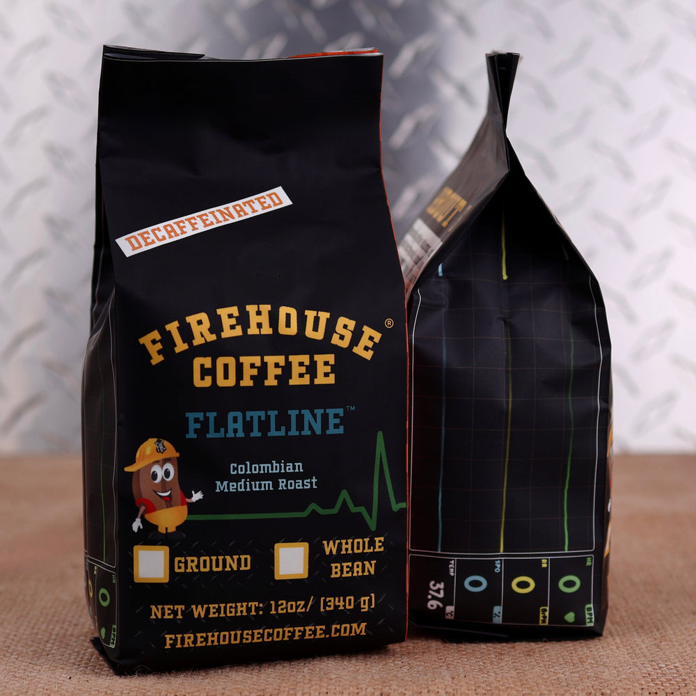 Firehouse Coffee Flatline Decaf Colombian Medium Roast coffee bag featuring an EKG monitor flatline design, premium Swiss Water® Process decaffeinated Colombian Arabica coffee, freshly roasted for a smooth, balanced cup with rich caramel and cocoa notes.