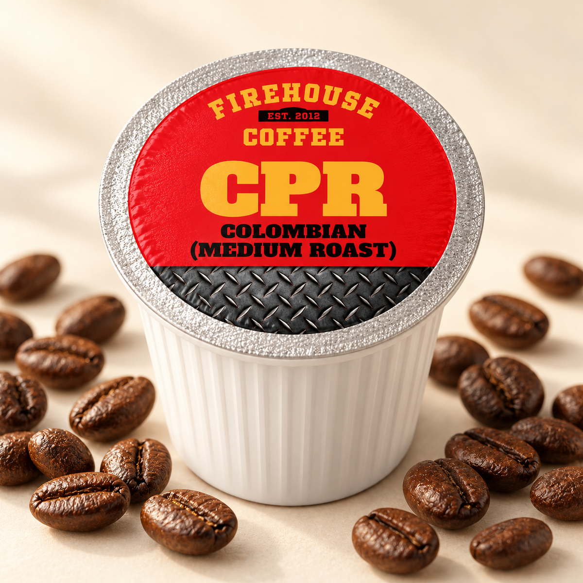Firehouse Coffee CPR Colombian medium roast K-Cup surrounded by roasted coffee beans on a warm cream background
