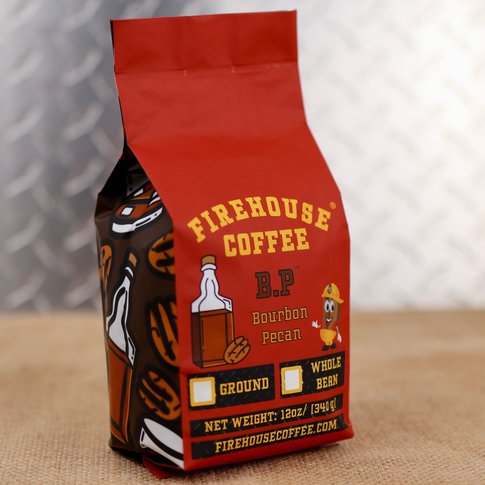 Firehouse Coffee B.P. Bourbon Pecan Flavored Coffee, 12 oz freshly roasted gourmet coffee with rich bourbon flavor, toasted pecans, and a smooth medium roast. Available in whole bean or ground, this premium flavored coffee is ideal for home brewing and makes a great gift for coffee lovers searching for bourbon coffee, pecan coffee, gourmet flavored coffee, specialty coffee, and artisan roasted coffee.