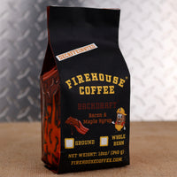 Firehouse Coffee Backdraft™ Decaf Bacon & Maple Syrup flavored coffee in a 12 oz bag featuring smoky bacon and sweet maple syrup flavor. Freshly roasted gourmet decaffeinated coffee available in whole bean or ground.