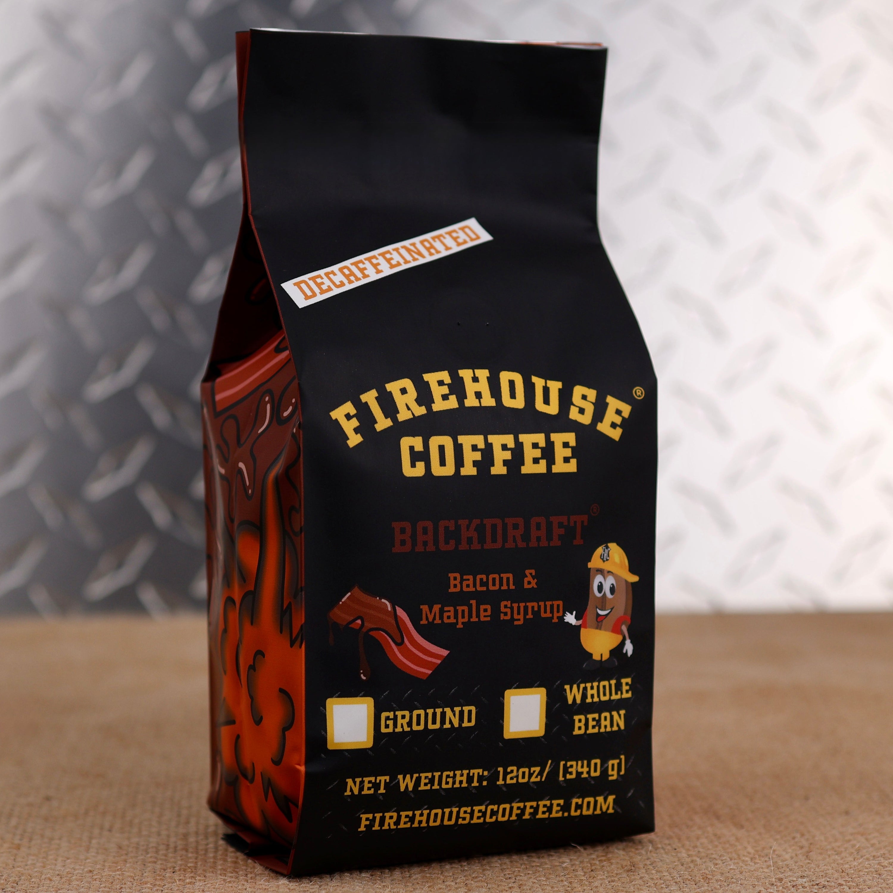 Firehouse Coffee Backdraft™ Decaf Bacon & Maple Syrup flavored coffee in a 12 oz bag featuring smoky bacon and sweet maple syrup flavor. Freshly roasted gourmet decaffeinated coffee available in whole bean or ground.