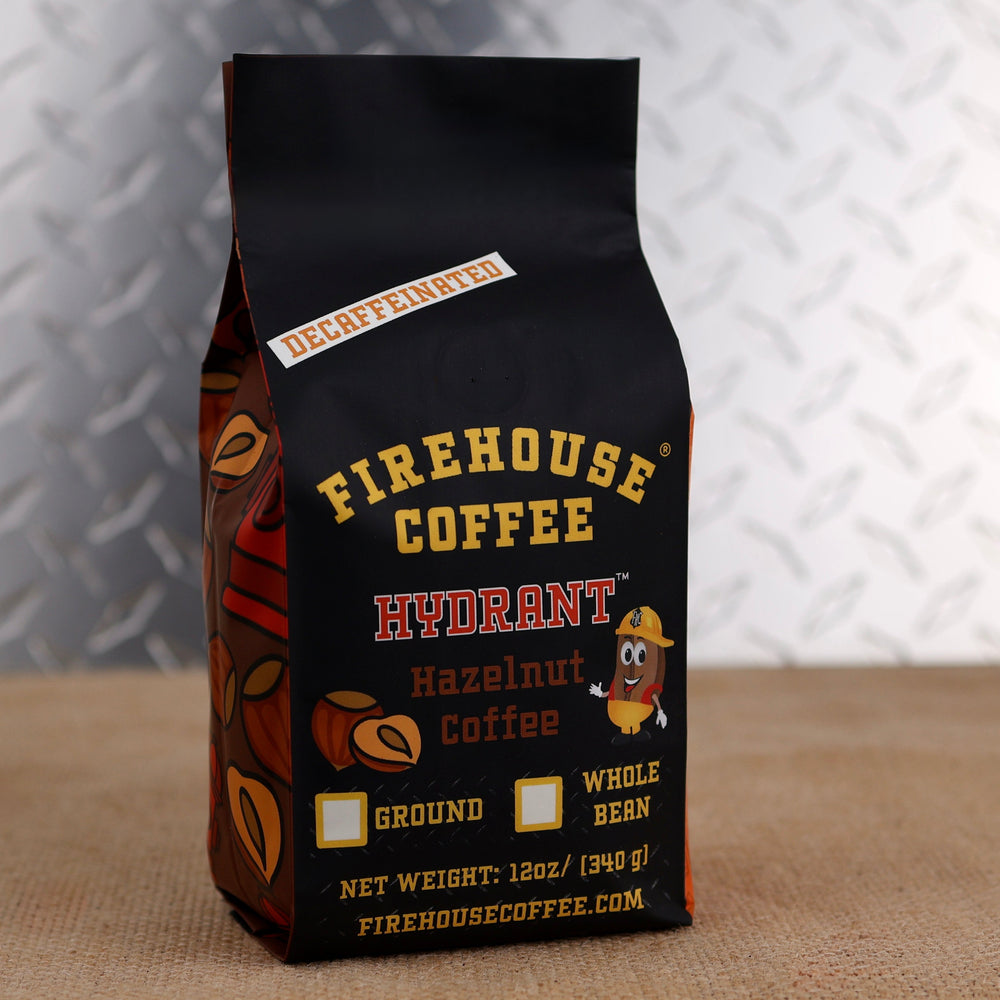12oz bag of Firehouse Coffee Decaf Hazelnut Coffee featuring premium Swiss Water Process decaf coffee with smooth roasted hazelnut flavor made from 100% Arabica beans.