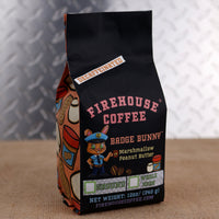 Firehouse Coffee Badge Bunny Decaf Marshmallow Peanut Butter Flavored Coffee in a 12 oz bag, made with Swiss Water Process decaffeinated coffee and infused with creamy peanut butter and fluffy marshmallow flavors. Fresh roasted and available in whole bean or ground with firefighter-themed packaging.