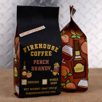 Firehouse Coffee Decaf Peach Brandy Flavored Coffee in a 12 oz bag, crafted with Swiss Water Process decaffeinated coffee and infused with the sweet flavor of ripe peaches and smooth brandy. Fresh roasted and available in whole bean or ground with firefighter-themed packaging.