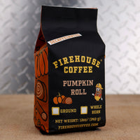 Firehouse Coffee Pumpkin Roll Decaf flavored coffee, 12oz premium Arabica coffee in a fall-themed bag with pumpkin roll, cinnamon, and vanilla flavors, naturally decaffeinated using the Swiss Water Process for a smooth, full-bodied cup.