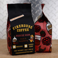Firehouse Coffee Decaf Rescue Rum Flavored Coffee 12oz bag featuring dark Jamaican rum and raspberry flavors, Swiss Water Process decaffeinated premium Arabica coffee, freshly roasted in small batches.