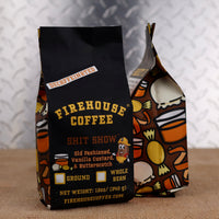 12 oz bag of Firehouse Coffee Shit Show Decaffeinated Coffee, a Swiss Water Process decaf flavored with Old Fashioned Whiskey, creamy Vanilla Custard, and rich Butterscotch. Bold firefighter-themed coffee packaging for premium flavored coffee lovers.