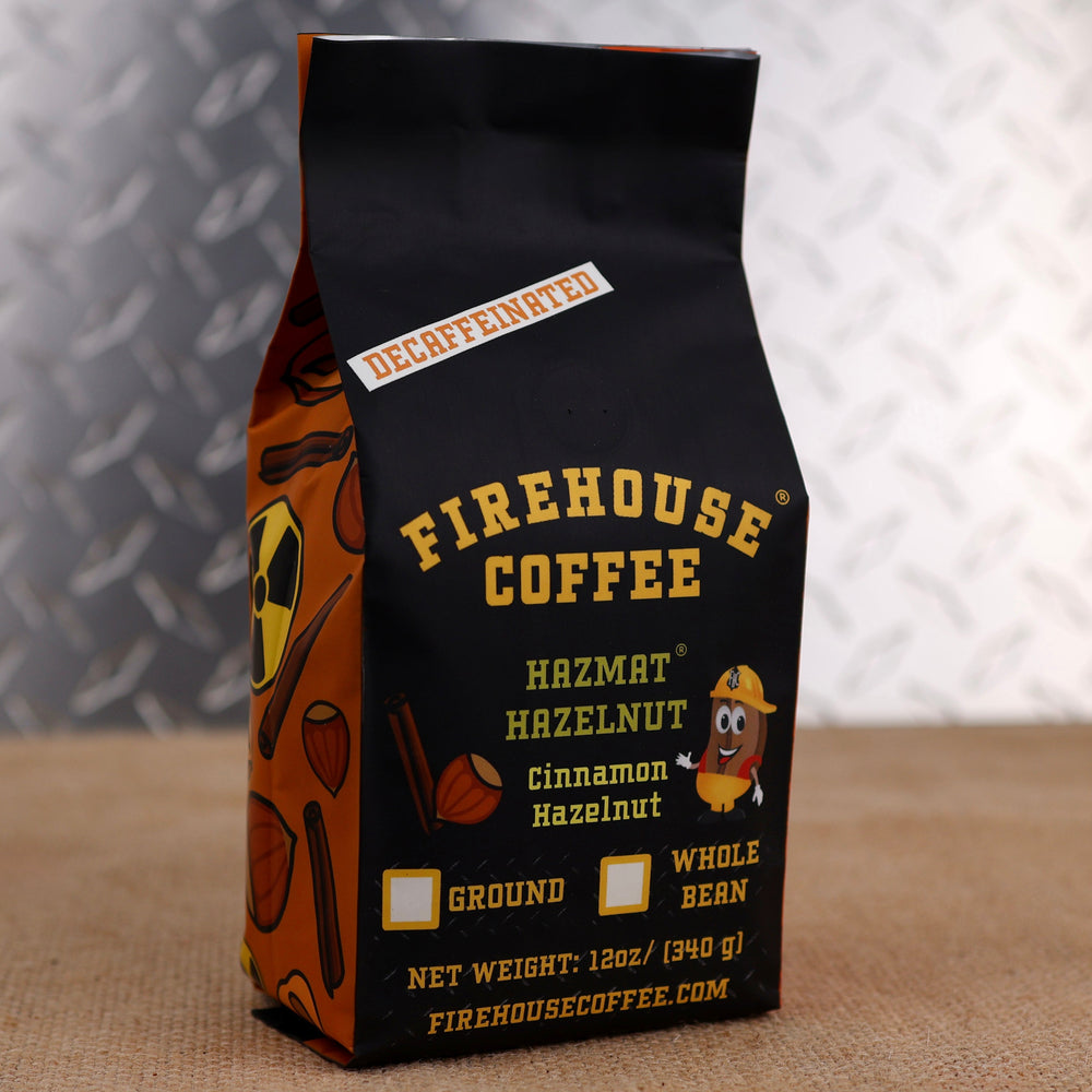 12oz bag of Firehouse Coffee Decaf Hazmat Hazelnut flavored coffee featuring cinnamon hazelnut flavor, Swiss Water Process decaf coffee with rich roasted hazelnut and cinnamon spice notes.