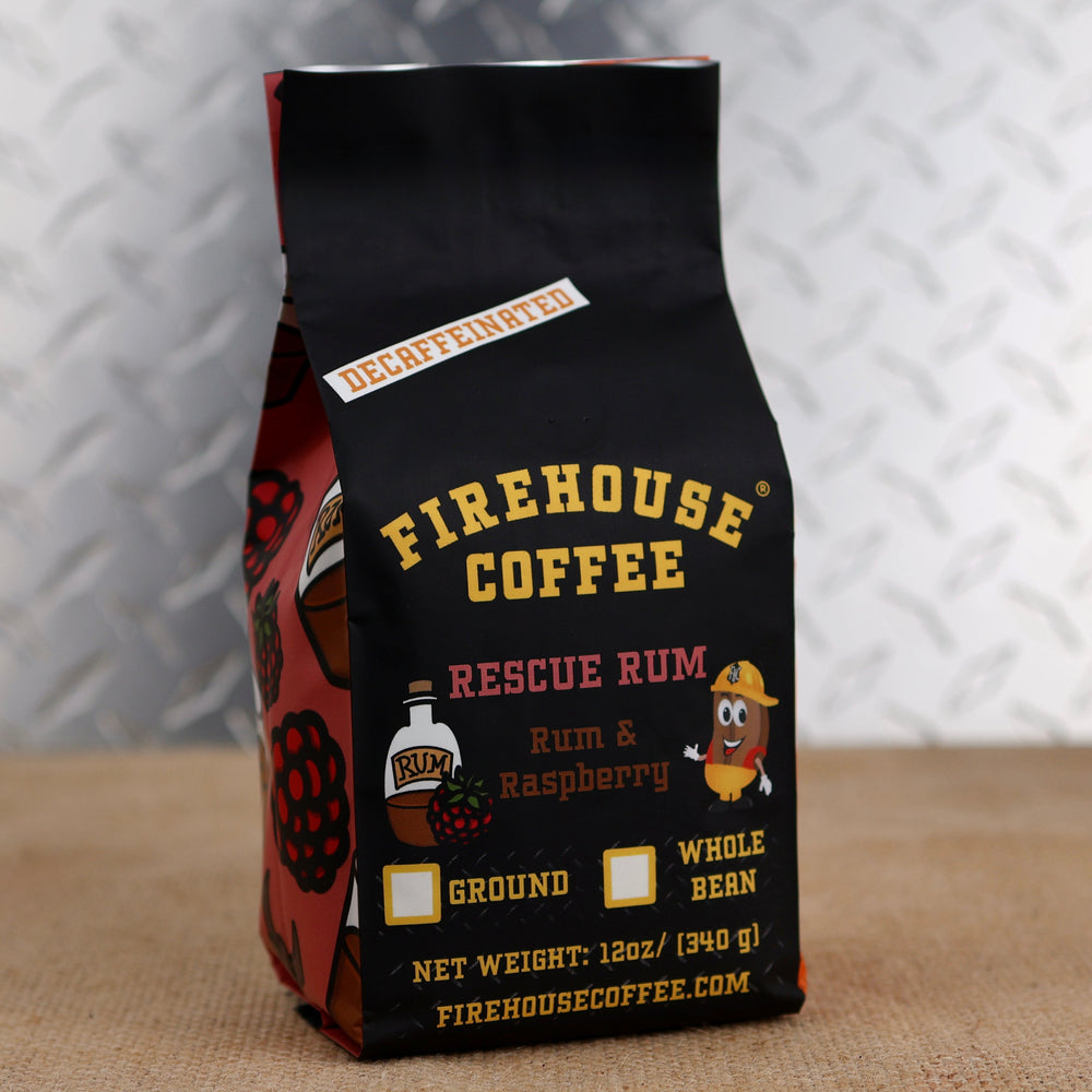 12oz bag of Firehouse Coffee Decaf Rescue Rum coffee with rich dark Jamaican rum and raspberry flavor, Swiss Water Process decaf coffee made from premium 100% Arabica beans.