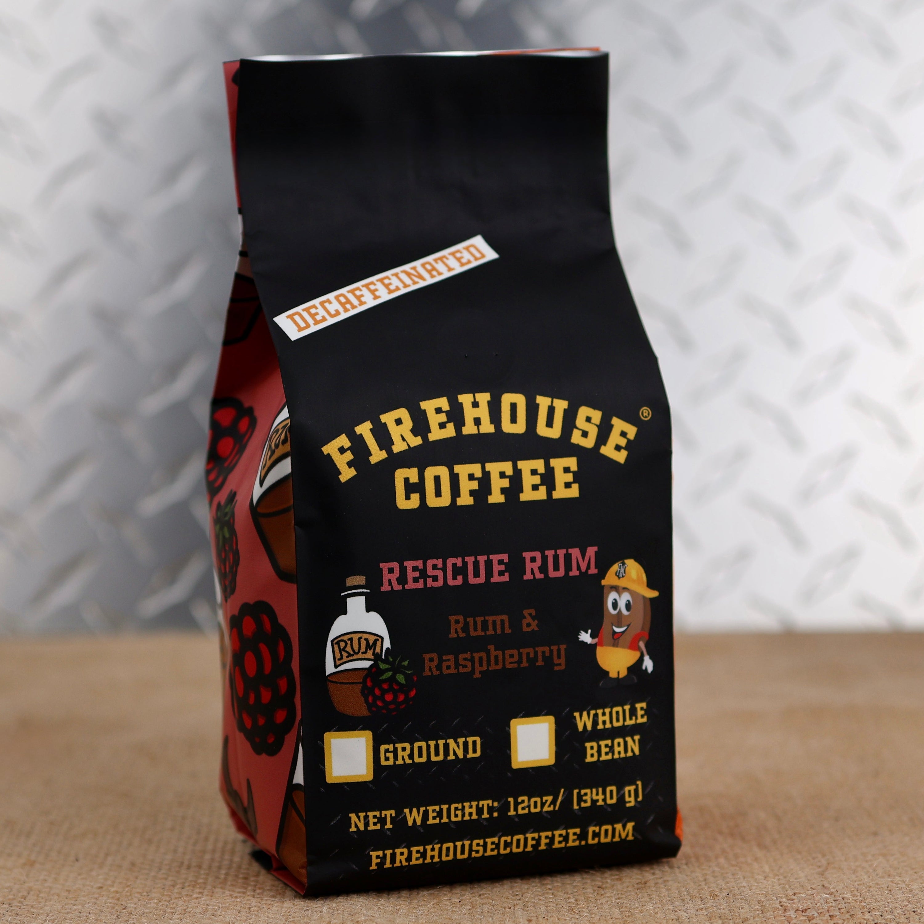 12oz bag of Firehouse Coffee Decaf Rescue Rum coffee with rich dark Jamaican rum and raspberry flavor, Swiss Water Process decaf coffee made from premium 100% Arabica beans.