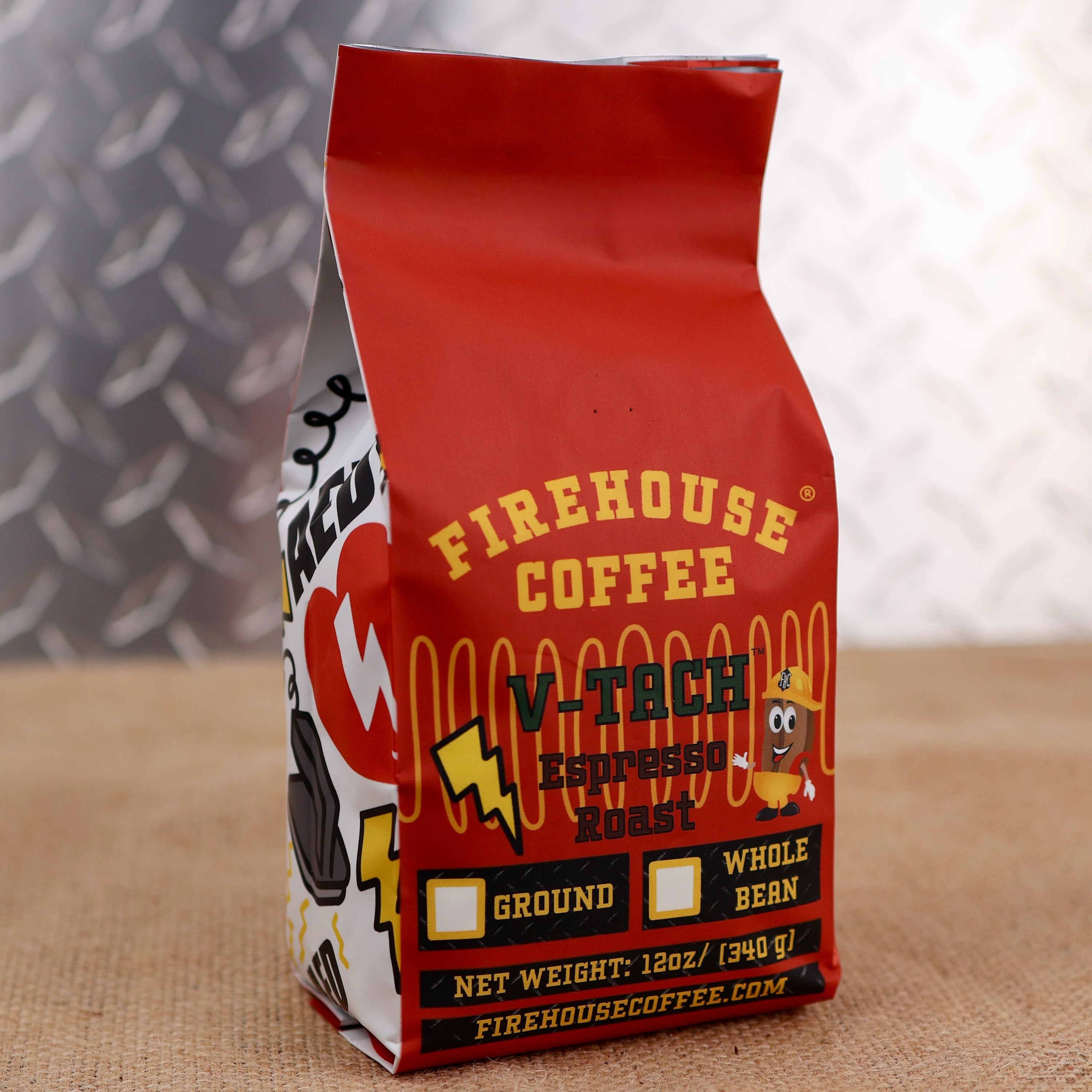 Firehouse V-Tach Espresso Roast Coffee in a 12 oz bag, available in whole bean or ground. Freshly roasted premium espresso coffee with bold, full-bodied flavor, rich crema, dark chocolate and caramel notes, and a smooth, lingering finish.