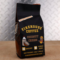 Firehouse Coffee Decaf Coconut Cream Flavored Coffee 12oz bag, Swiss Water Process decaffeinated premium Arabica coffee with rich coconut cream, smooth vanilla, and tropical flavor, freshly roasted in small batches.