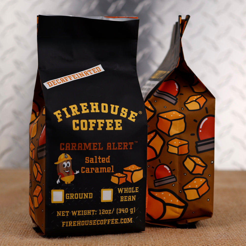 Firehouse Coffee Caramel Alert Decaf Salted Caramel Flavored Coffee in a 12 oz bag, crafted with Swiss Water Process decaffeinated coffee and rich salted caramel flavor. Fresh roasted, available in whole bean or ground, with Firehouse Coffee's signature firefighter-themed packaging.