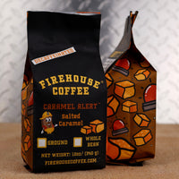 Firehouse Coffee Caramel Alert Decaf Salted Caramel Flavored Coffee in a 12 oz bag, crafted with Swiss Water Process decaffeinated coffee and rich salted caramel flavor. Fresh roasted, available in whole bean or ground, with Firehouse Coffee's signature firefighter-themed packaging.