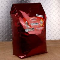 Firehouse Coffee Backdraft™ Decaf Bacon & Maple Syrup coffee in a 5 lb bulk bag blends smoky bacon flavor with sweet maple syrup in a freshly roasted gourmet decaffeinated coffee. Available in whole bean or ground.