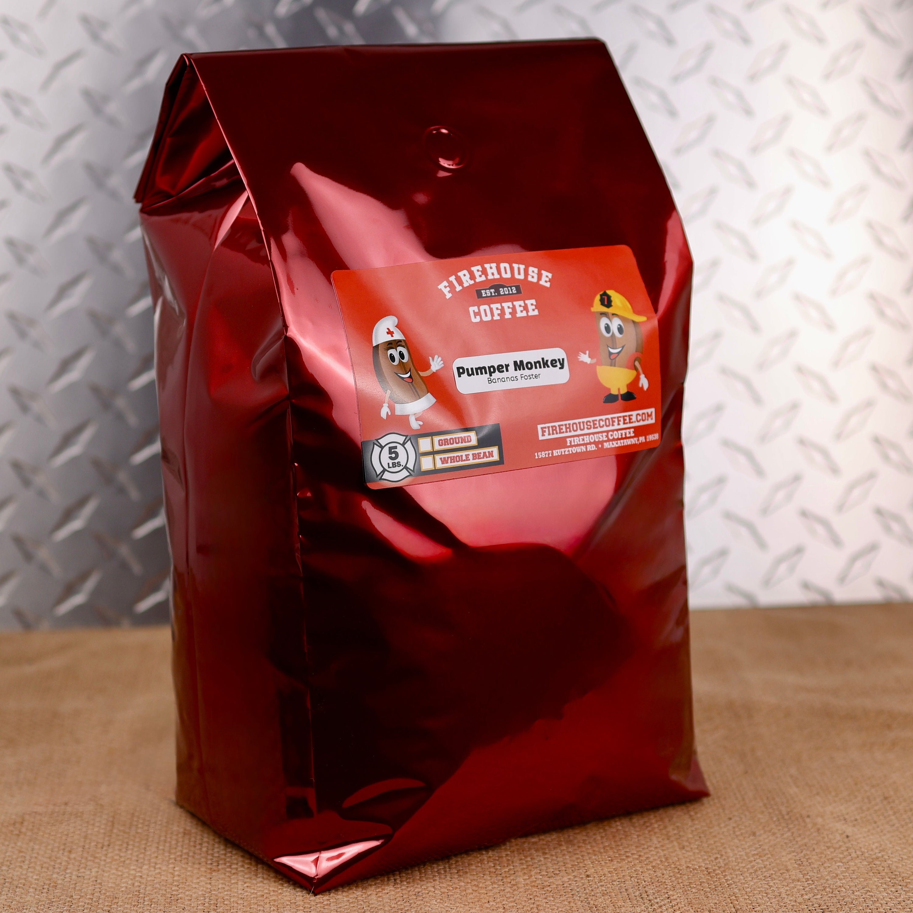 Firehouse Coffee Pumper Monkey Bananas Foster Flavored Coffee, premium 5 lb freshly roasted gourmet coffee with decadent banana, buttery caramel, brown sugar, and rum-inspired Bananas Foster flavors. Available in whole bean or ground, this artisan specialty coffee delivers a rich dessert-inspired taste for flavored coffee lovers, gourmet coffee enthusiasts, and small-batch roasted coffee fans.