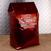 Firehouse Coffee Hazmat Hazelnut Cinnamon Hazelnut Flavored Coffee in a 5 lb bag, freshly roasted gourmet coffee with rich hazelnut, sweet cinnamon, and roasted nut flavors. Available in whole bean or ground, this premium flavored coffee is ideal for home, office, cafés, restaurants, and coffee lovers searching for cinnamon hazelnut coffee, hazelnut flavored coffee, and gourmet flavored coffee.
