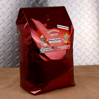 Red 5lb bag of Firehouse Coffee Decaffeinated Cherry Flutter Chocolate Cherry flavored coffee with the firefighter bean mascot, and options for ground or whole bean. Swiss Water Process decaf gourmet coffee roasted in small batches.