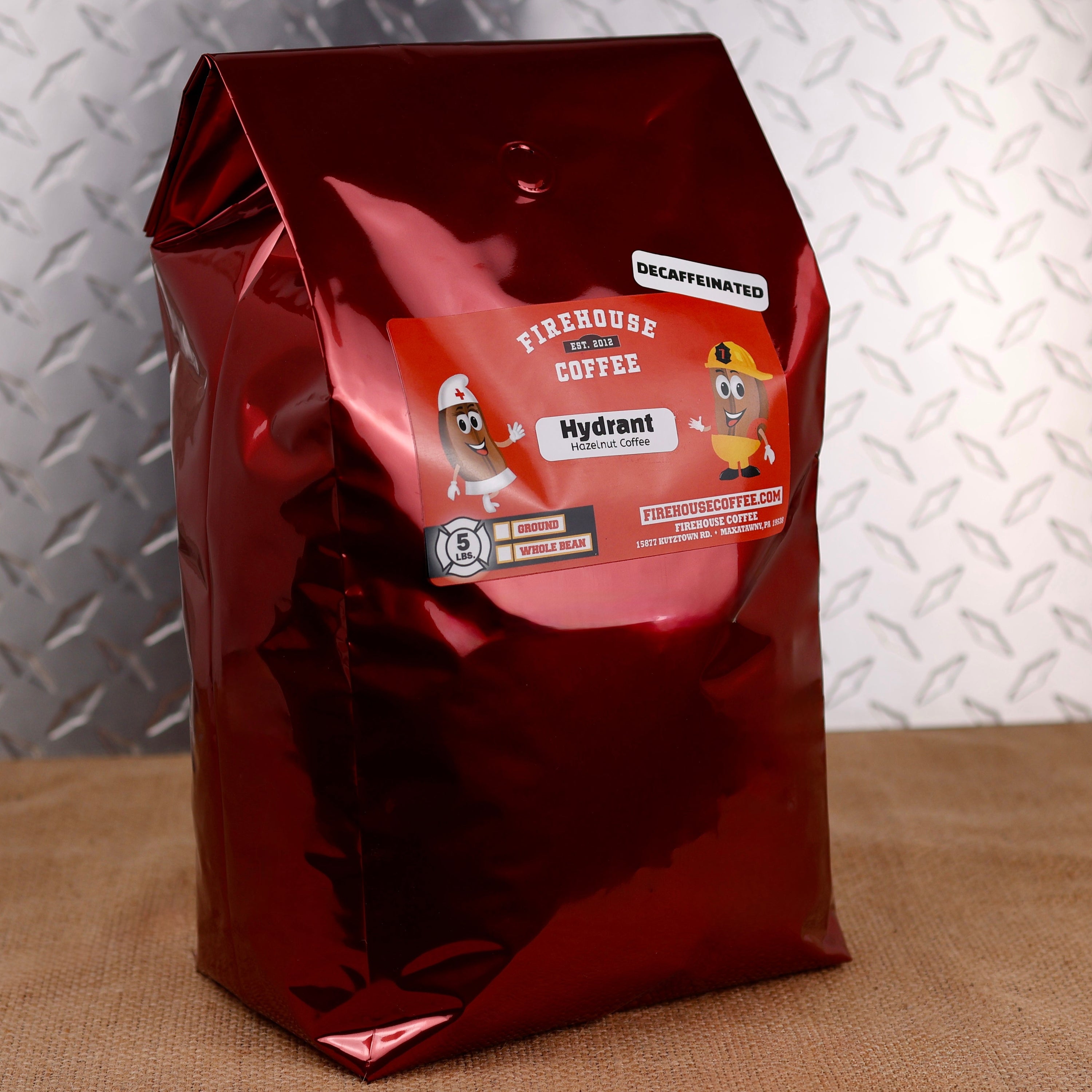 5lb Bag Firehouse Coffee Decaf Hazelnut Flavored Coffee, naturally decaffeinated using the Swiss Water Process, offering rich hazelnut aroma, smooth medium roast, and freshly roasted premium Arabica coffee.