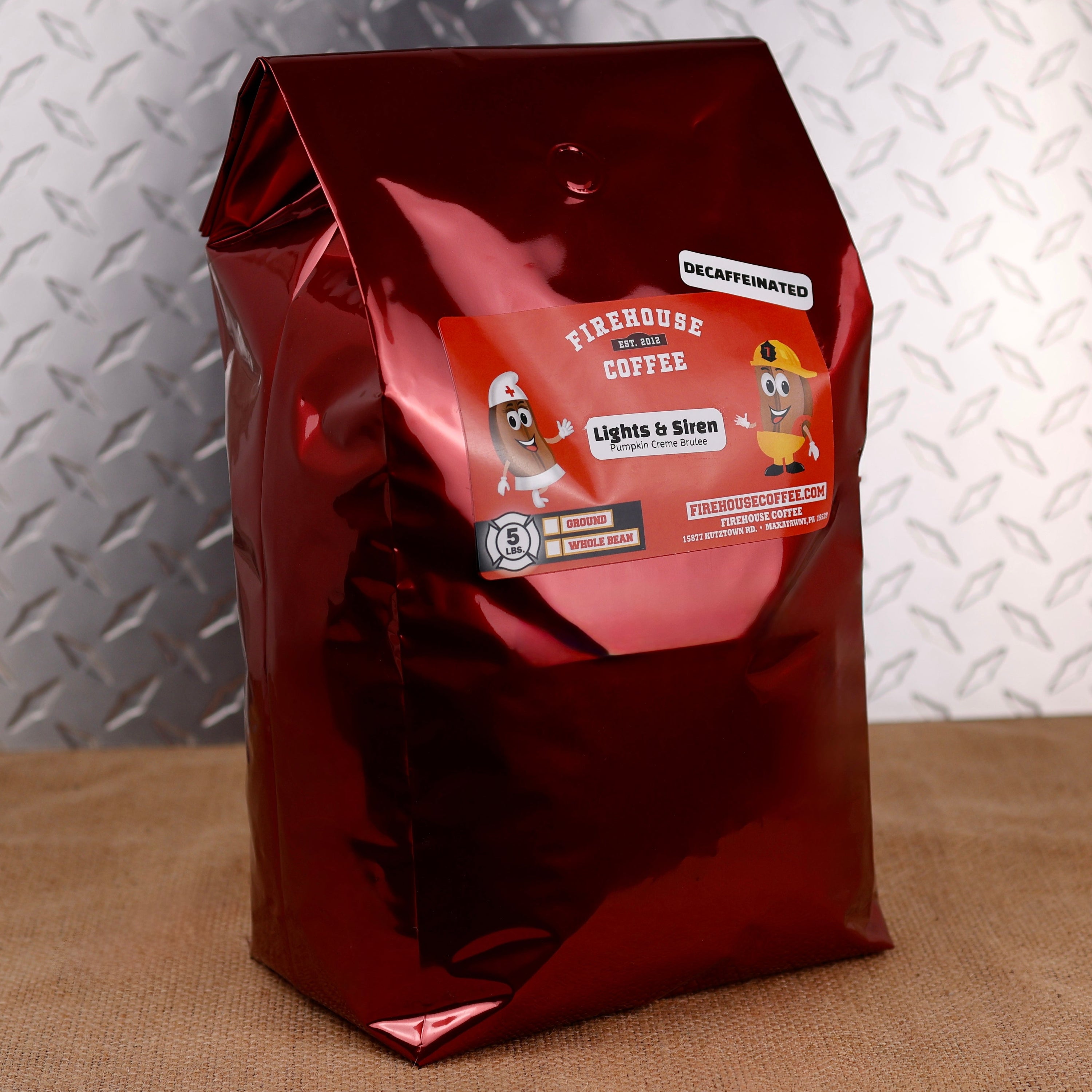 5 lb bag of Firehouse Coffee Lights & Sirens Pumpkin Crème Brûlée Decaf coffee. Premium Swiss Water Process decaffeinated coffee with smooth pumpkin spice and creamy crème brûlée flavor, available as whole bean or freshly ground.