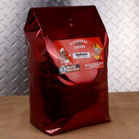 Firehouse Coffee Hydrant Hazelnut Flavored Coffee in a 5 lb bag, featuring the rich aroma of roasted hazelnuts blended with freshly roasted premium coffee. Available in whole bean or ground, this gourmet hazelnut coffee is packaged in a glossy red Firehouse Coffee bag with a fun first responder-themed Hydrant label.