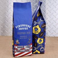 Firehouse Coffee Coffee Cop Colombian Dark Roast coffee bag featuring a bold blue police-themed design with handcuffs, badges, coffee beans, and firefighter-roasted coffee branding.