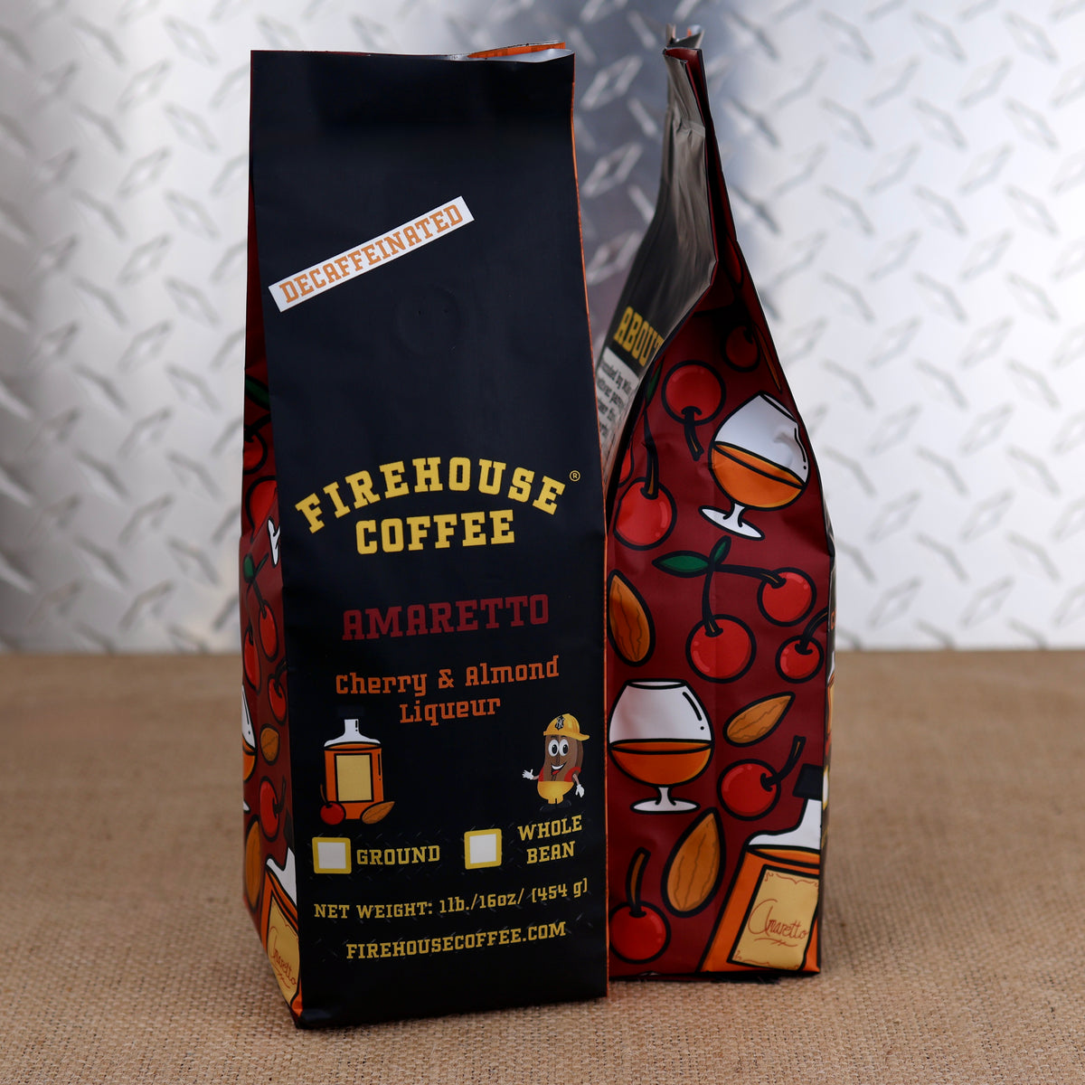 Decaf Firehouse Coffee bag in the Amaretto flavor, showcasing a pattern of cherries and amaretto glasses.