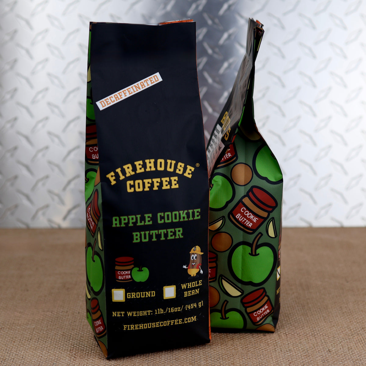 A decaffeinated bag of Firehouse Coffee Apple Cookie Butter flavor next to a bag showing its apple side pattern.