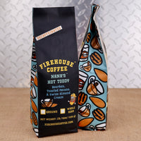 Firehouse Coffee Nana’s Hot Toddy™ Bourbon, Toasted Pecan & Swiss Almond Cream flavored decaf coffee in a 1 lb bag.