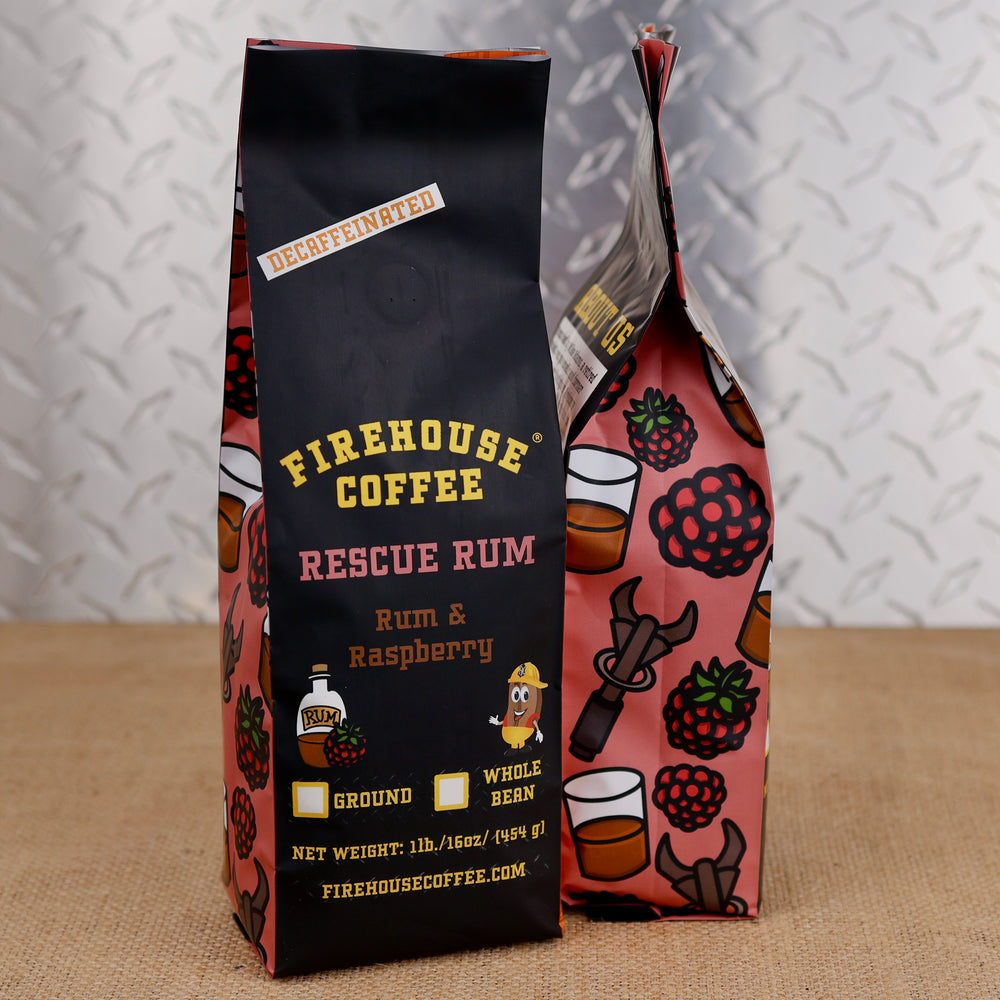 Firehouse Coffee Rescue Rum decaf rum and raspberry flavored coffee in a 1 lb bag with raspberry and rescue tool illustrations.