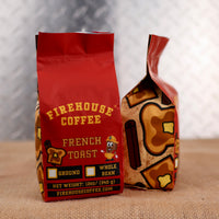 Firehouse Coffee French Toast coffee bag on a textured surface with a photo of toast and a cinnamon stick in the background