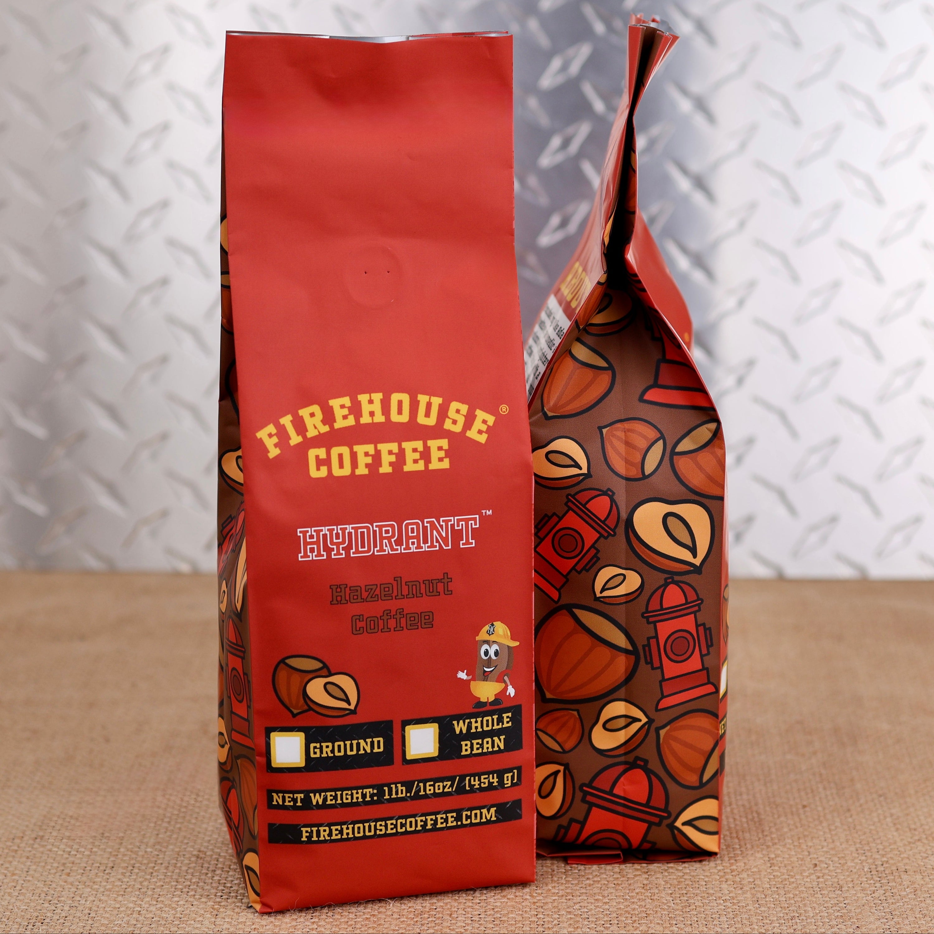 Firehouse Coffee Hydrant Hazelnut flavored coffee in a 1 lb bag, available ground or whole bean, featuring smooth, rich hazelnut flavor.