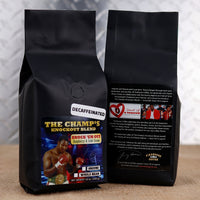Firehouse Coffee Larry Holmes Knock 'Em Out Decaf Rum & Raspberry flavored coffee featuring boxing legend Larry Holmes on the label, available in whole bean or ground in a 12 oz bag.