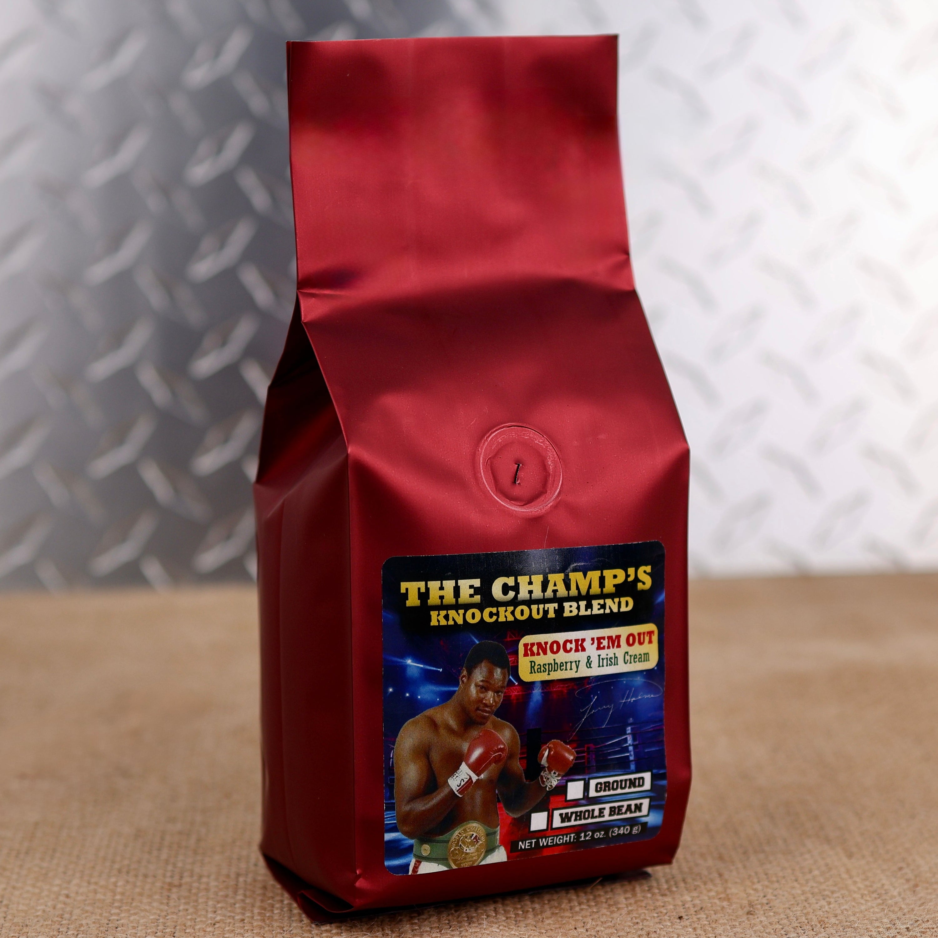Larry Holmes Knock 'Em Out Blend by Firehouse Coffee featuring Rum & Raspberry flavored coffee with creamy Irish cream and ripe raspberry notes, available in whole bean or ground.