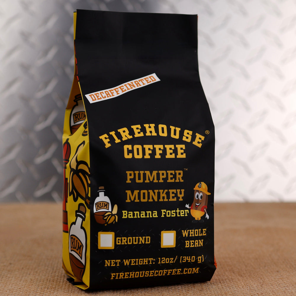Firehouse Coffee Pumper Monkey Decaf Banana Foster flavored coffee in a 12 oz bag featuring rich banana, buttery caramel, cinnamon, and rum-inspired flavors. Freshly roasted decaffeinated coffee available in whole bean or ground.