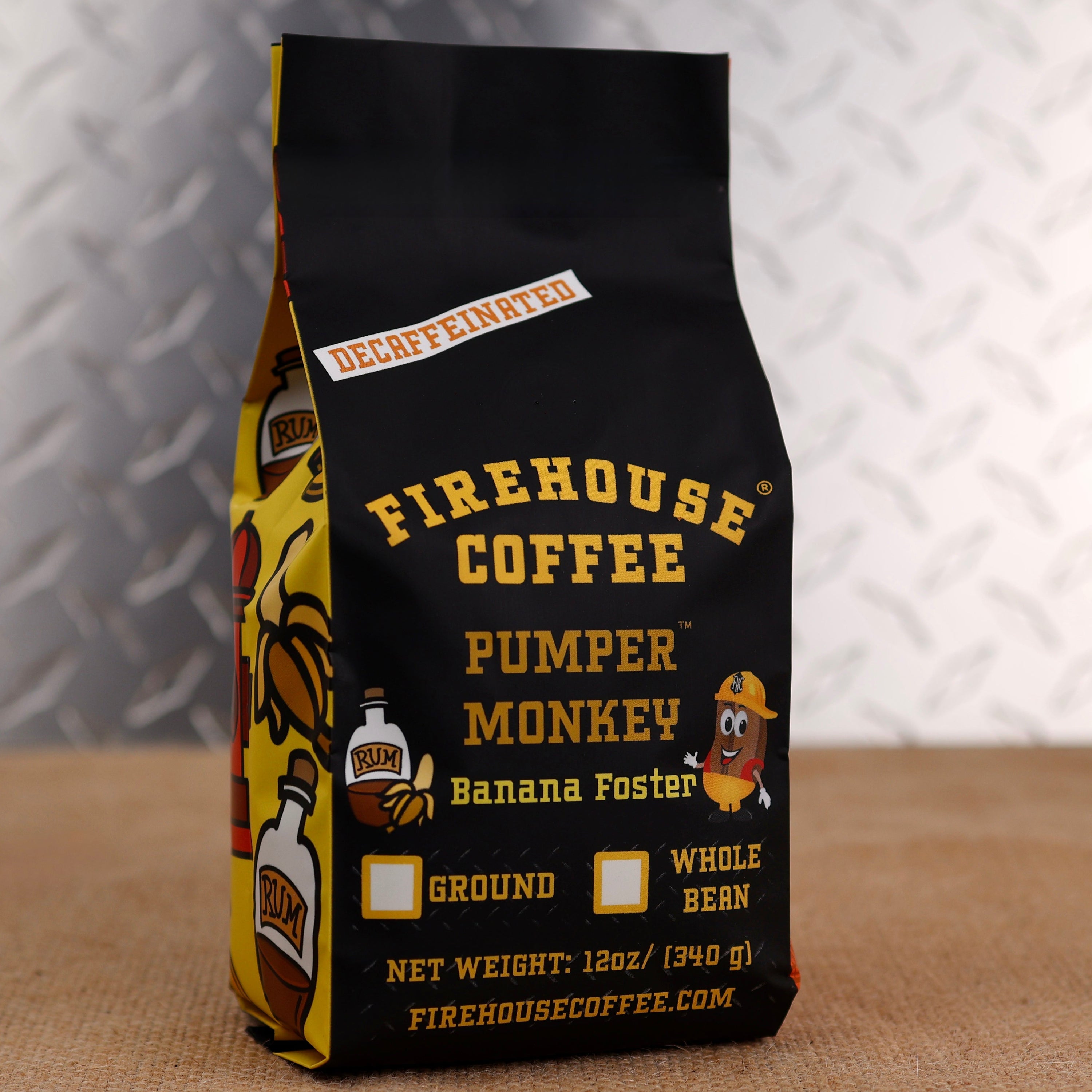 Firehouse Coffee Pumper Monkey Decaf Banana Foster flavored coffee in a 12 oz bag featuring rich banana, buttery caramel, cinnamon, and rum-inspired flavors. Freshly roasted decaffeinated coffee available in whole bean or ground.