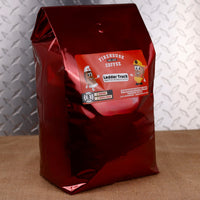 Firehouse Coffee Ladder Truck Aged Whiskey & Vanilla Coffee, 5 lb fresh roasted flavored coffee featuring rich aged whiskey notes blended with sweet vanilla. Gourmet coffee available in whole bean or ground for a smooth, bold, and aromatic brewing experience.
