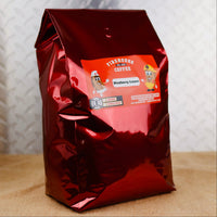 Five-pound bag of Blueberry Explosion™ Blueberry Cream Flavored Coffee with blueberry and vanilla cream flavors.