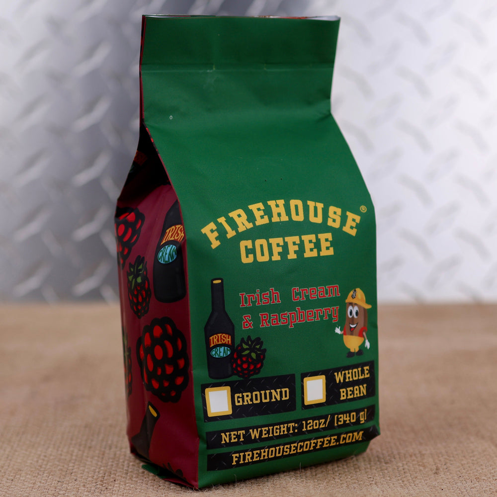 Firehouse Coffee Irish Cream & Raspberry flavored coffee in a 12 oz bag featuring rich Irish cream and sweet raspberry flavors. The package showcases Firehouse Coffee branding, raspberry graphics, and options for ground or whole bean coffee.