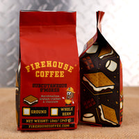 Firehouse Coffee Subcutaneous S’mores flavored coffee in a 12 oz red coffee bag featuring rich chocolate, toasted marshmallow, and graham cracker flavors. The package includes s’mores graphics, Firehouse Coffee branding, and options for ground or whole bean coffee.