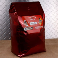 Firehouse Coffee Trauma Mama Wild Rum & Caramel flavored coffee in a 5 lb bulk bag, freshly roasted gourmet coffee available in whole bean or ground for offices, restaurants, cafés, and coffee lovers.